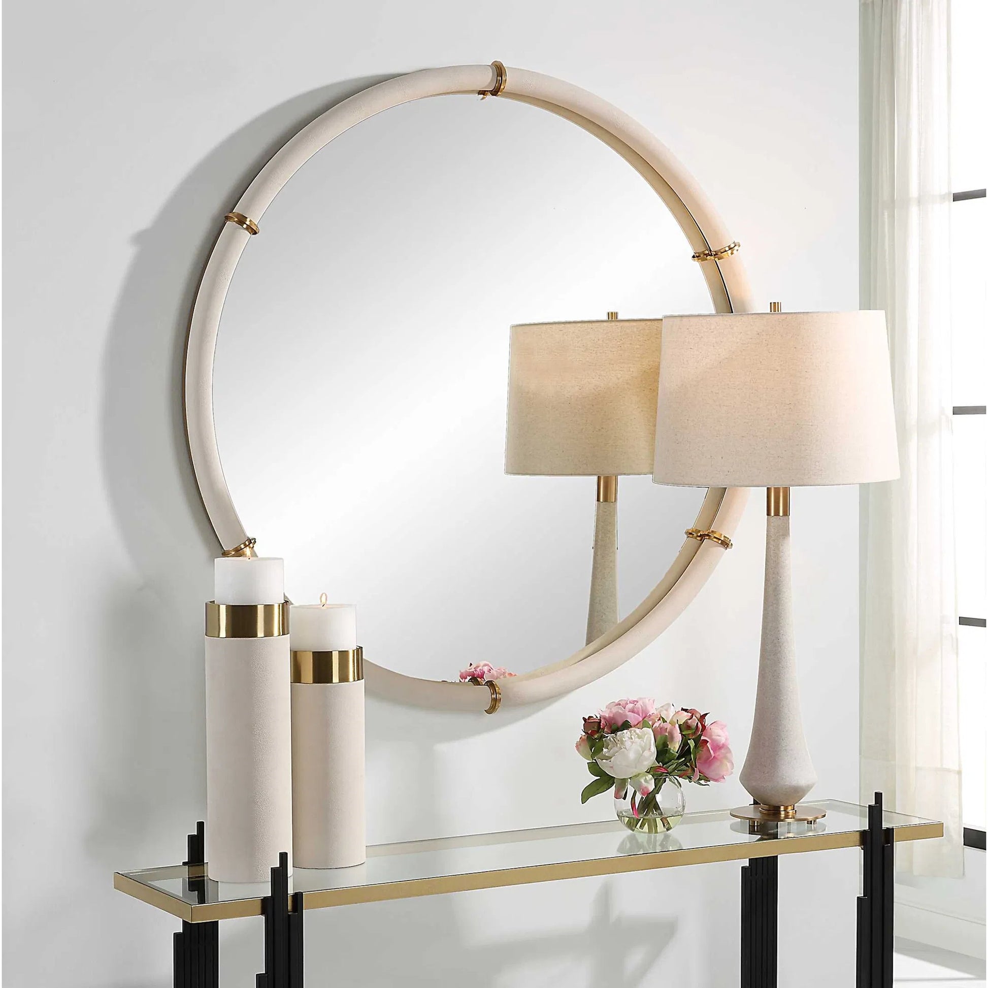 Cyprus Round Mirror by Uttermost in brass. Made from steel, mirror, mdf, pu leather, aluminum in a modern style.