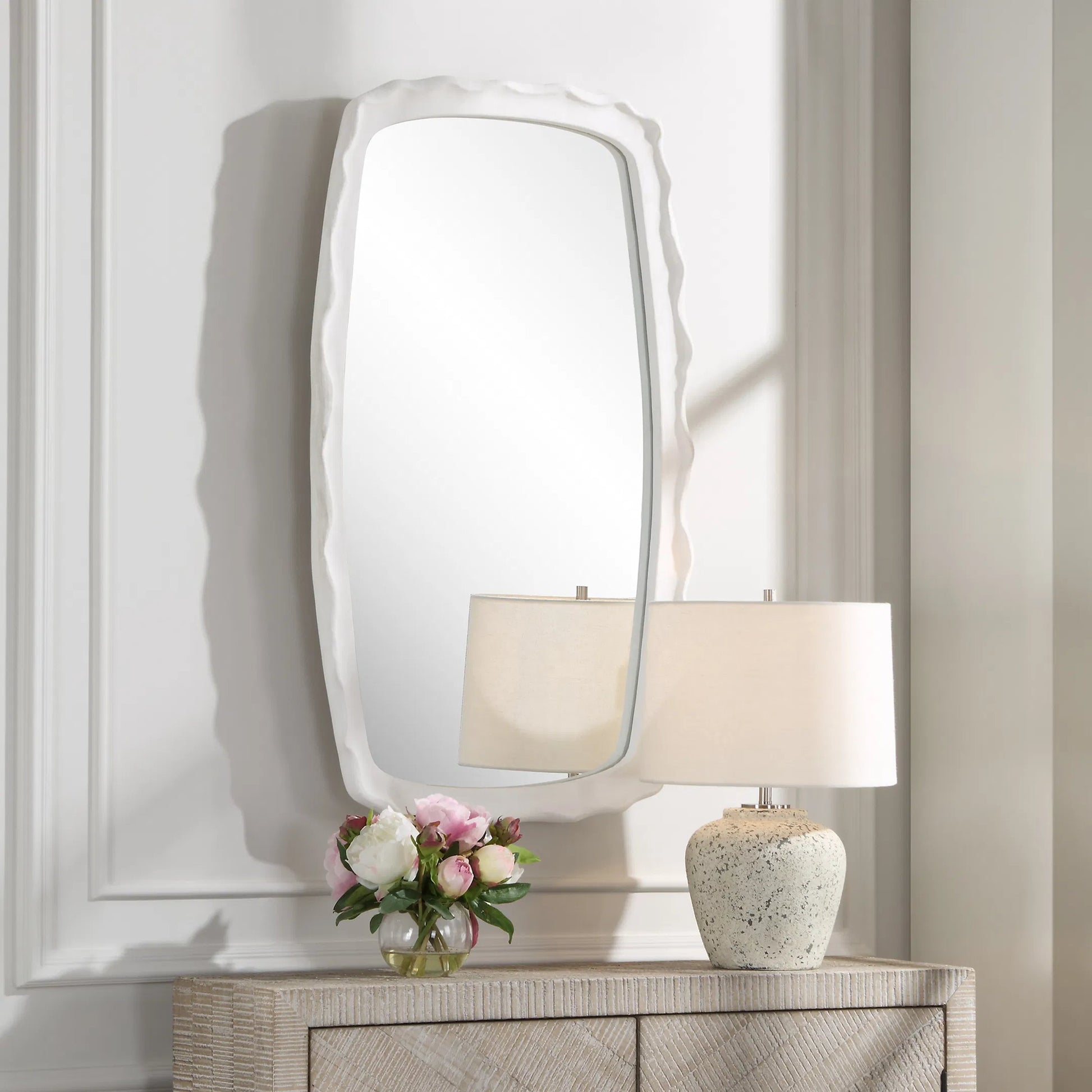 Marbella Mirror by Uttermost in white. Made from iron, mdf, glass, resin in a transitional style.