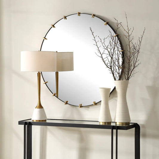 Pali Industrial Round Mirror by Uttermost in gold. Made from iron, mdf, glass in a transitional style.