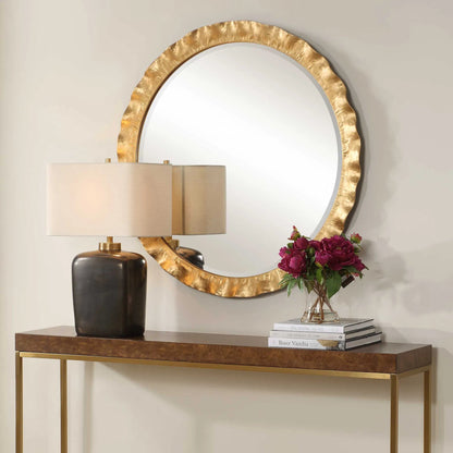 Haya Round Mirror by Uttermost in gold leaf. Made from iron, mirror, mdf in a transitional style.