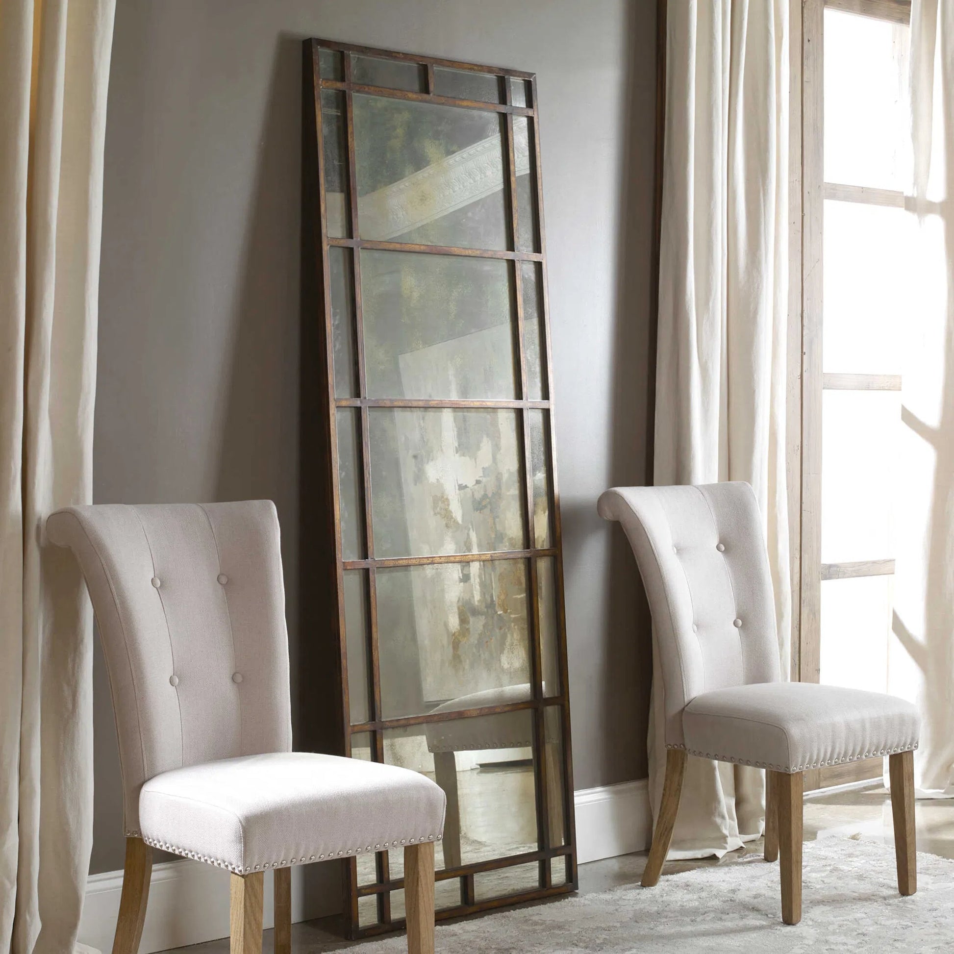 Avidan Mirror by Uttermost in gold. Made from metal in a modern style.