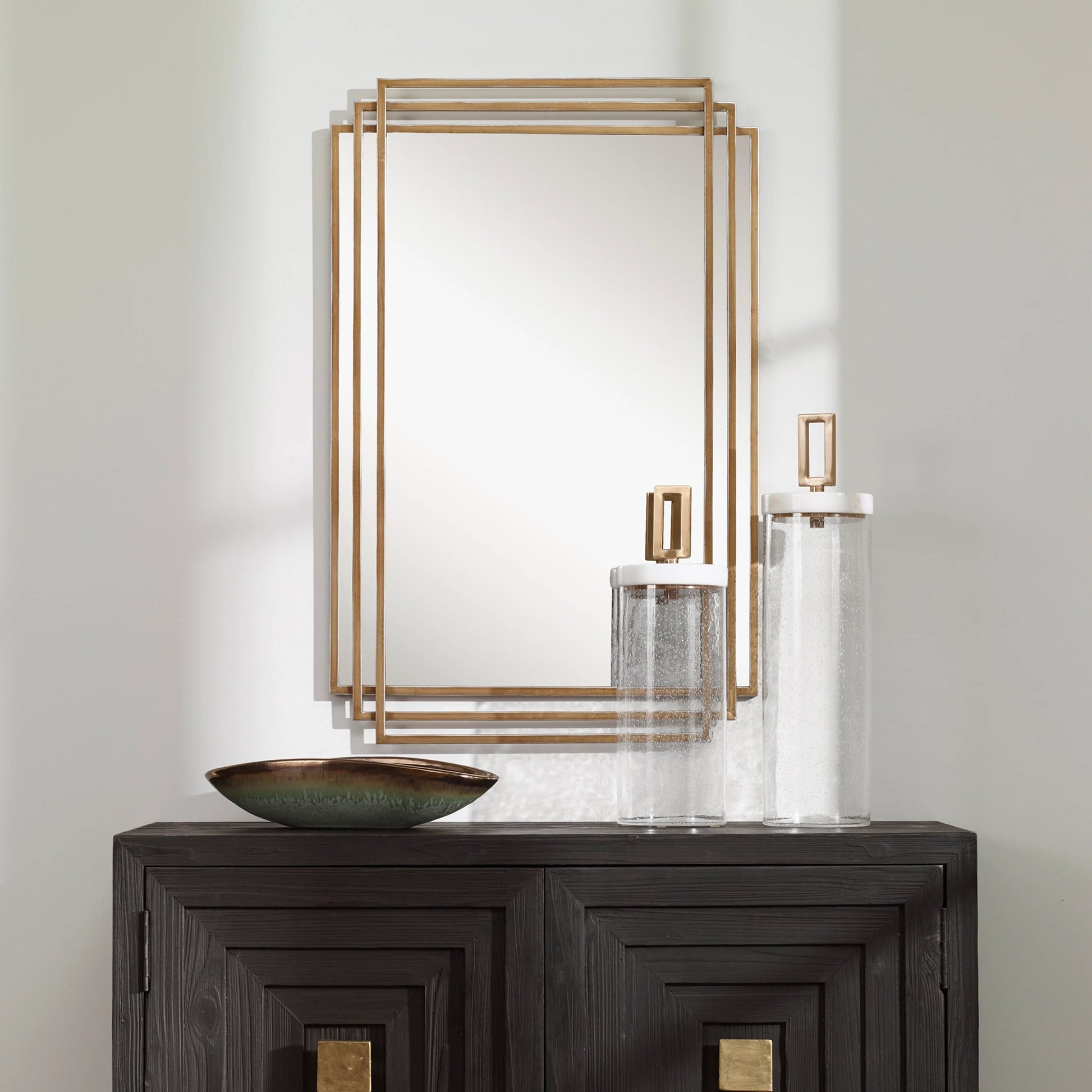 Amherst Brushed Mirror by Uttermost in gold. Made from iron, mdf, mirror in a transitional style.