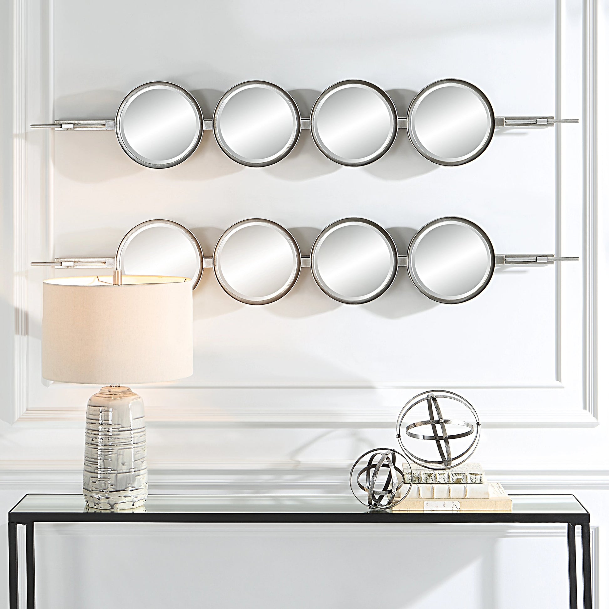 Button Mirror by Uttermost. Made from iron, mdf, glass in a transitional style.