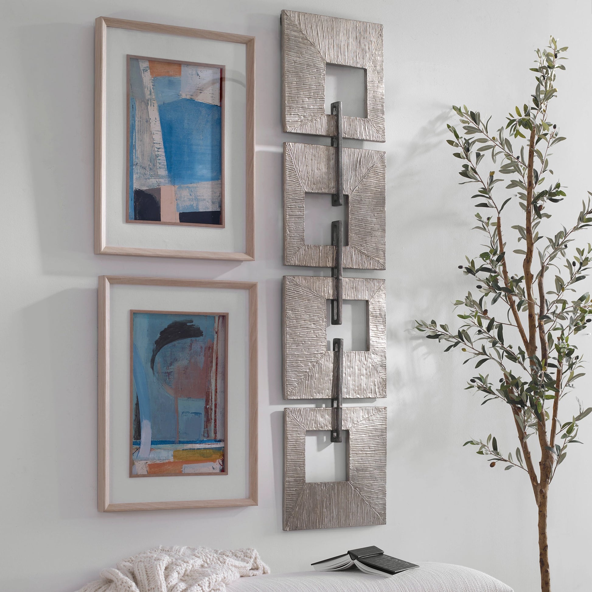 Linked Wall Decor by Uttermost in champagne gold, aged silver. Made from iron sheet in a modern style.