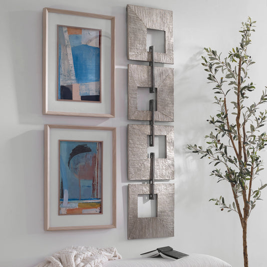Linked Wall Decor by Uttermost in champagne gold, aged silver. Made from iron sheet in a modern style.