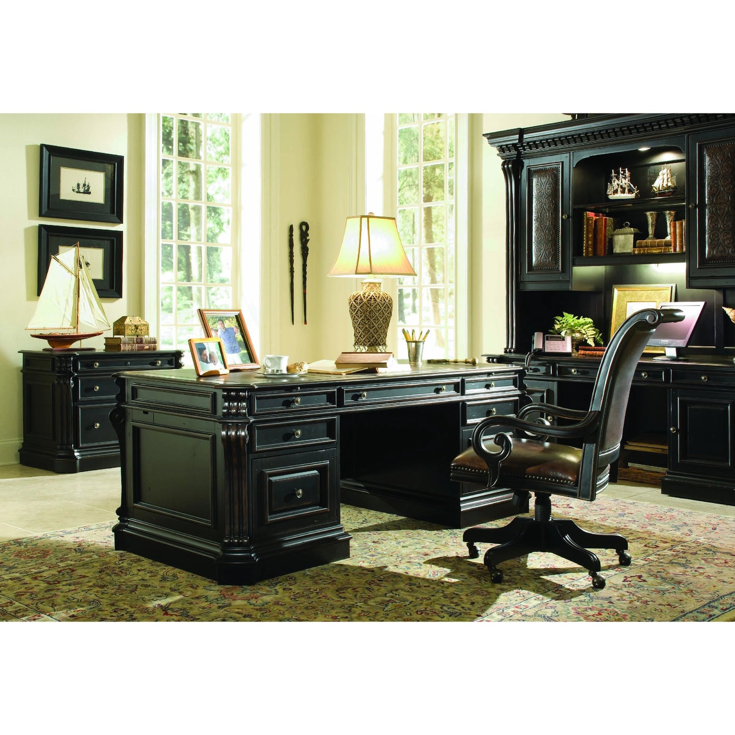 005 SI-1749887 | Lifestyle | Telluride Tilt Swivel Chair by Hooker Furniture in brown. Made from cherry veneers with carved leather (aniline plus pigment), nailhead trim in a traditional style.