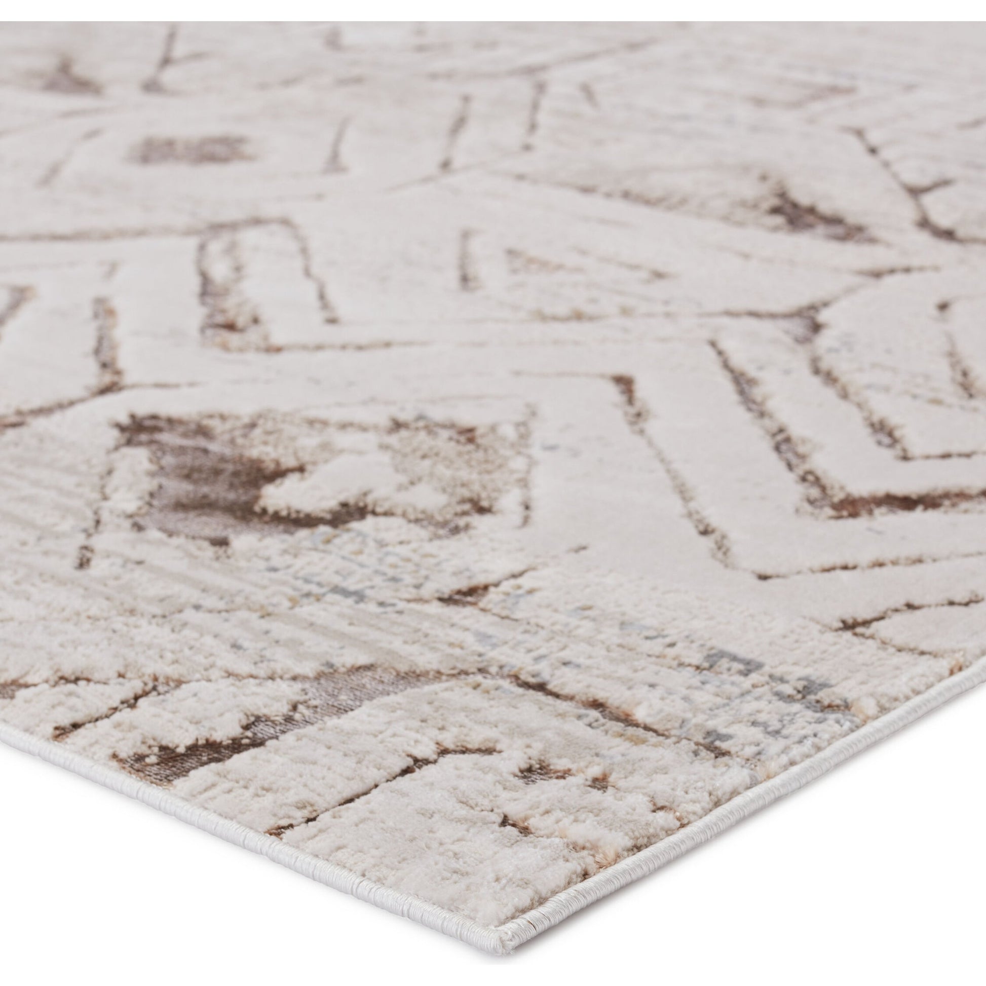 Malilla by Nikki Chu MLI06 Rug by Jaipur Living in cream, taupe. Made from 65% polyester 35% polypropylene in a unique style.