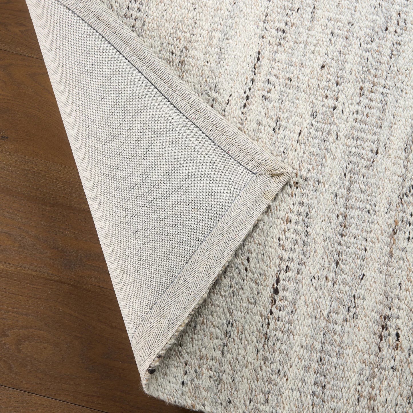 004 SI-2542799,SI-2542800,SI-2542801 | Closeup | Melera MLR01 Rug by Jaipur Living in tan, beige, ivory, white. Made from 80% wool 20% jute in a unique style.