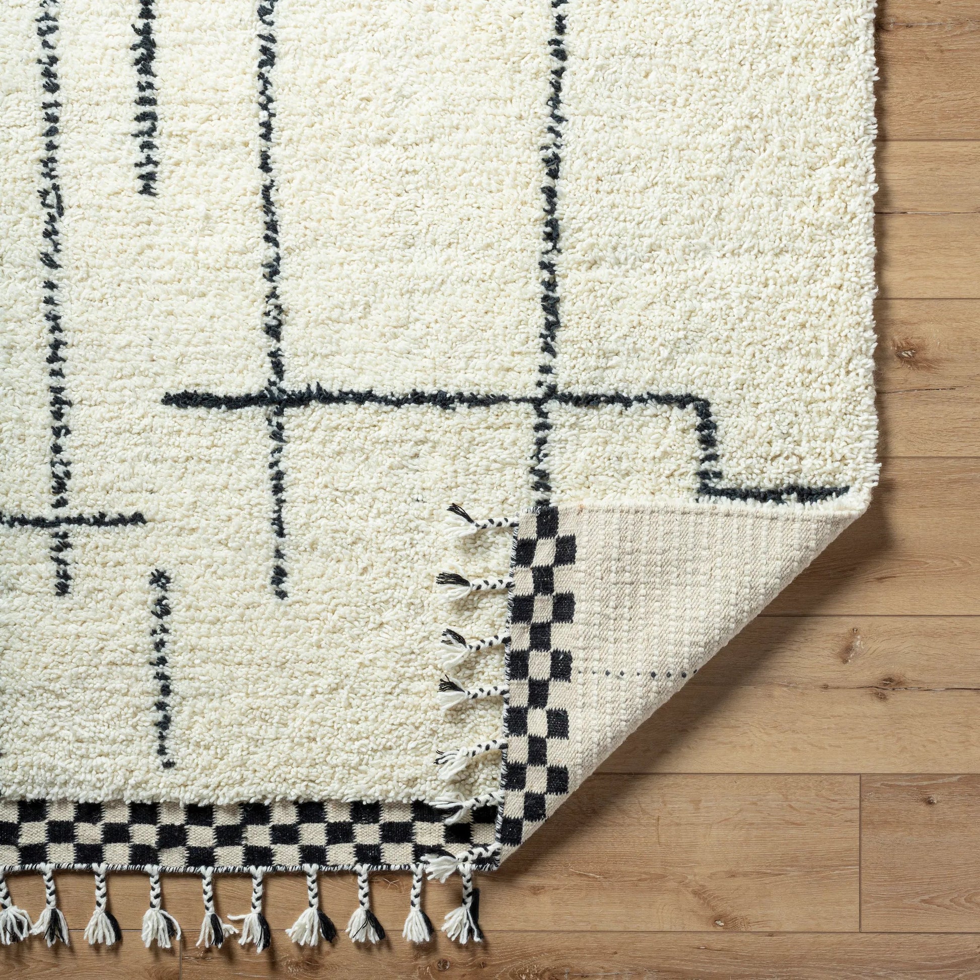 Mirela MMI-2300 Rug by Livabliss in ivory, charcoal, jet black. Made from face: 100% wool, warp: 100% cotton in a unique style.