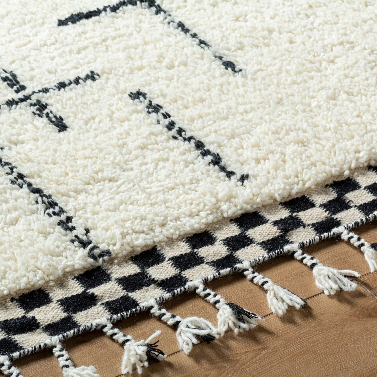 004 SI-2131543,SI-2131544,SI-2131545,SI-2131546 | Closeup | Mirela MMI-2300 Rug by Livabliss in ivory, charcoal, jet black. Made from face: 100% wool, warp: 100% cotton in a unique style.