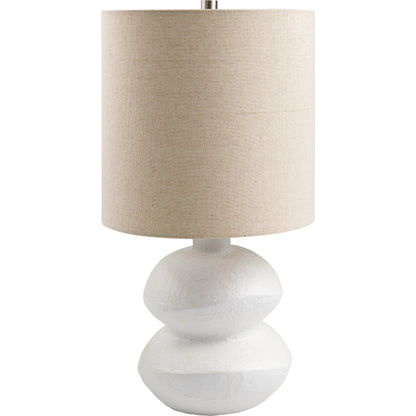 Mauna - 500112 by Livabliss in body: white, shade: wheat, finial: metallic - brass, harp: metallic - brass, cord: translucent and colored, polished. Made from body: ceramic, shade (outside): linen, shade (inside): polyester,
