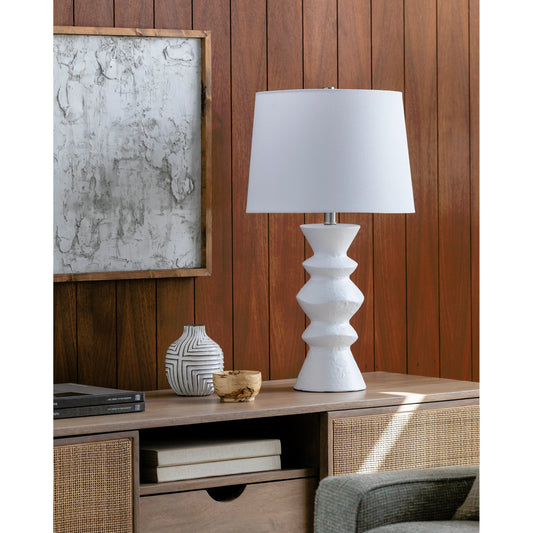Mauna - 500109 by Surya in body: white, shade: beige, finial: metallic - brass, harp: metallic - brass, cord: translucent and colored, polished. Made from body: ceramic, shade (outside): linen, shade (inside): polyester, finial