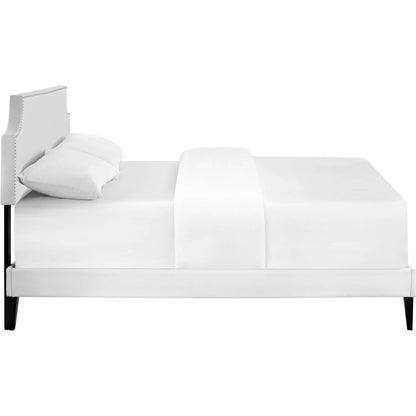 Ava Platform Bed with Squared Tapered Legs by Evans & Londeen in white. Made from vinyl in a transitional style.