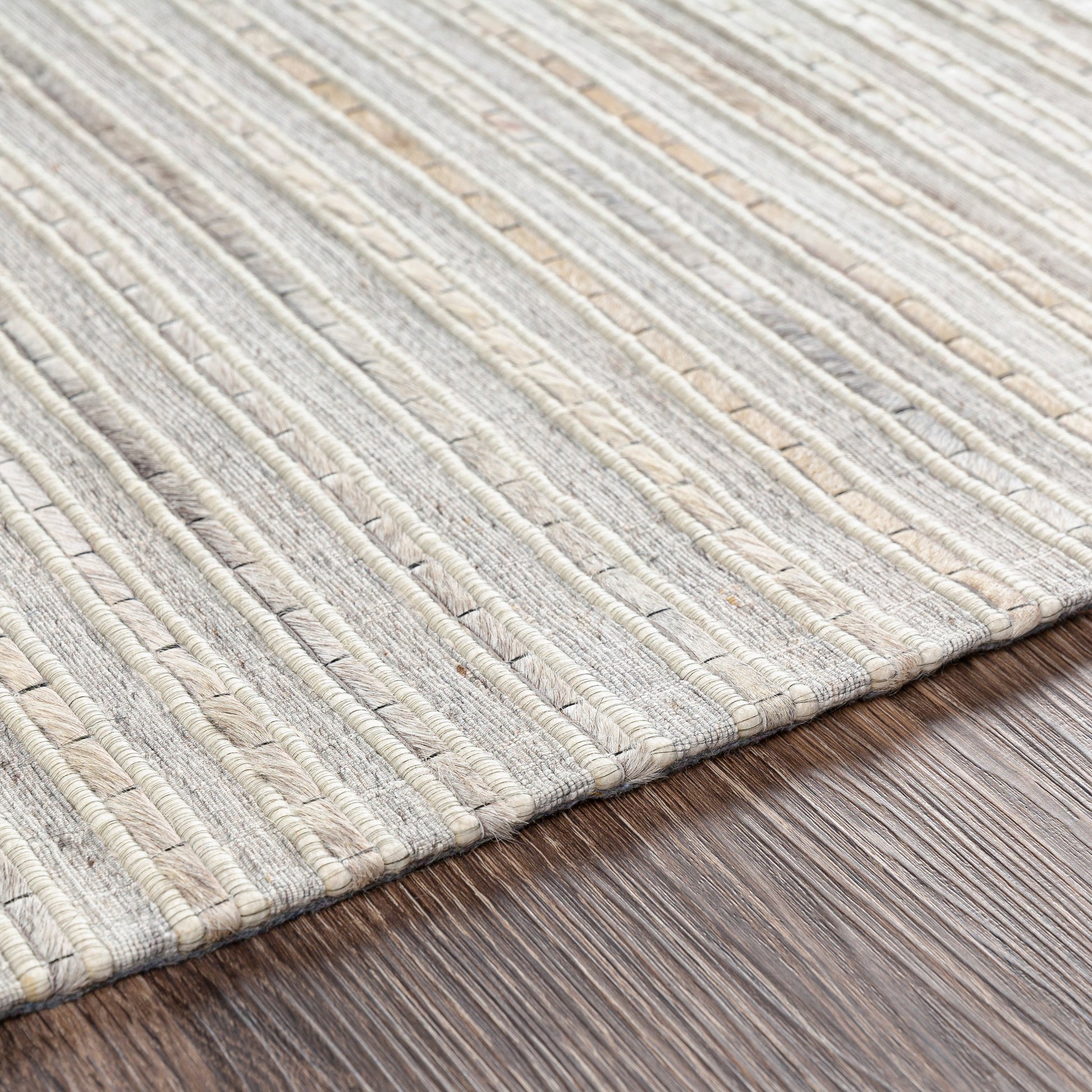 Medora Rug - 26072 by Surya in taupe, dark brown, oatmeal, black, medium gray. Made from 50% wool, 30% hair on hide, 20% viscose in a unique style.