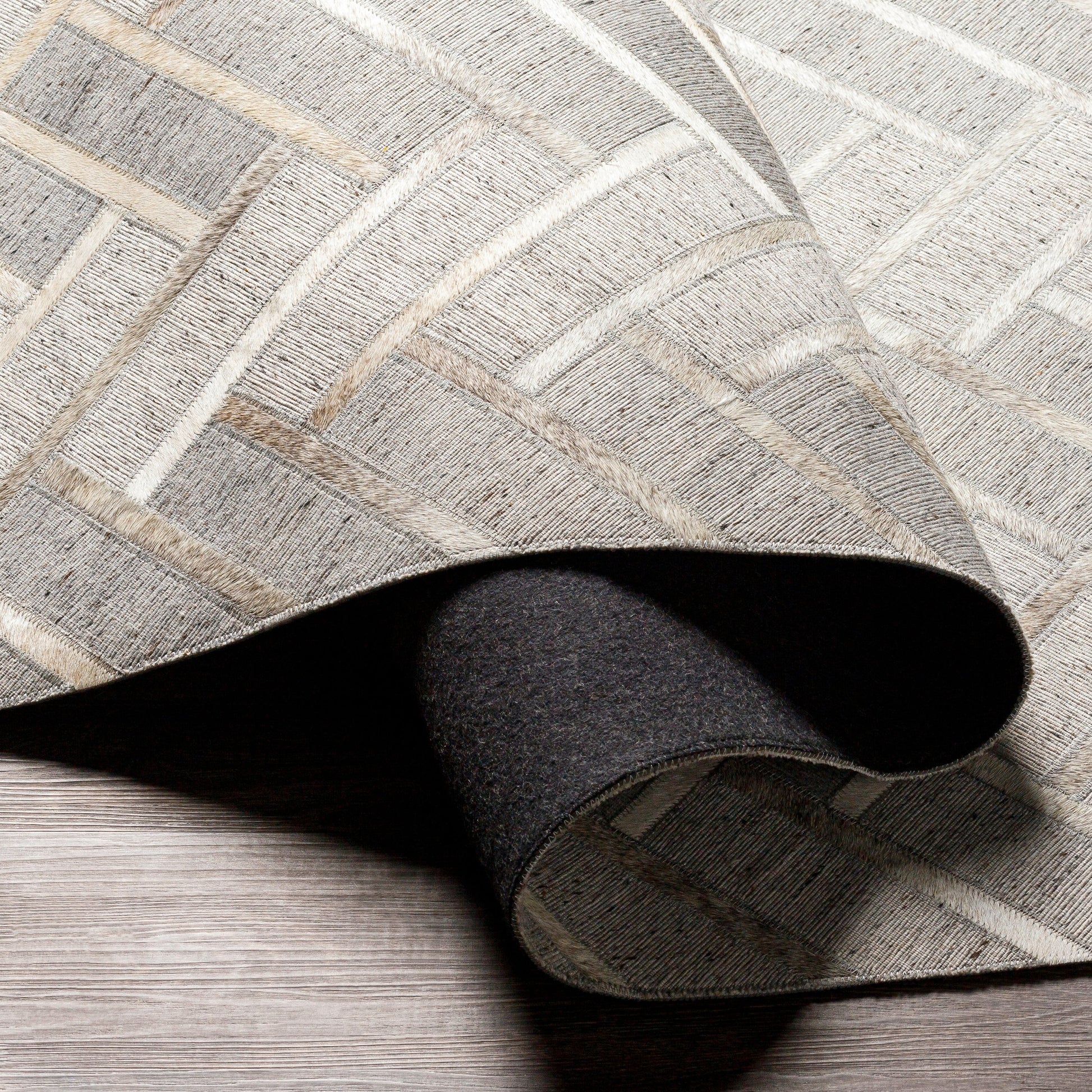 Medora Rug - 30192 by Surya in taupe, medium gray, oatmeal, tan, medium brown, light gray. Made from 65% viscose, 35% leather in a unique style.