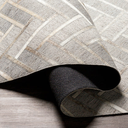 Medora Rug - 30192 by Surya in taupe, medium gray, oatmeal, tan, medium brown, light gray. Made from 65% viscose, 35% leather in a unique style.