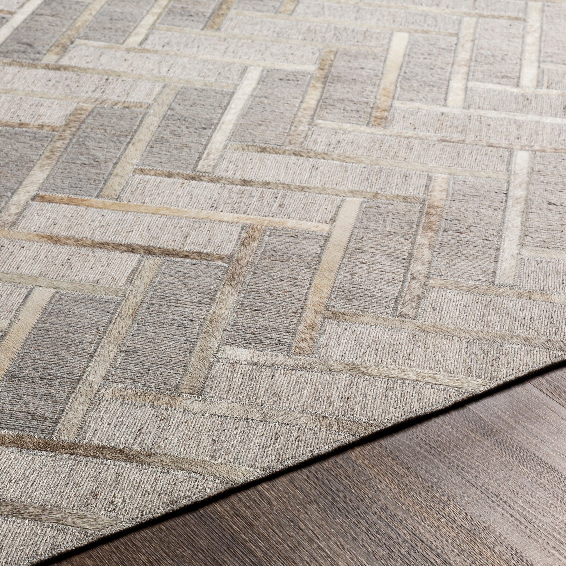 Medora Rug - 30192 by Surya in taupe, medium gray, oatmeal, tan, medium brown, light gray. Made from 65% viscose, 35% leather in a unique style.
