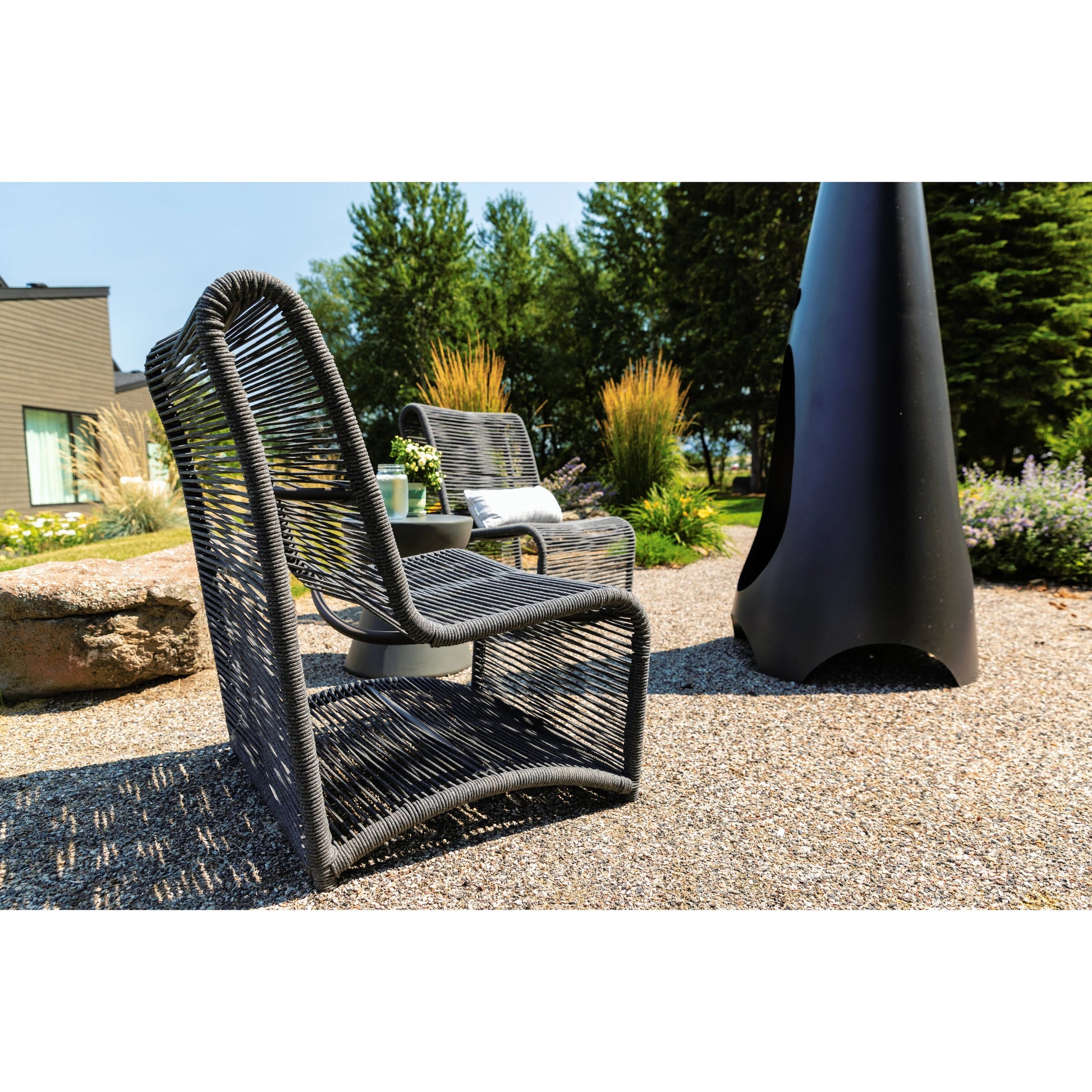 Milano Outdoor Armless Club Chair by Sunset West. Made from olefin rope in a coastal style.
