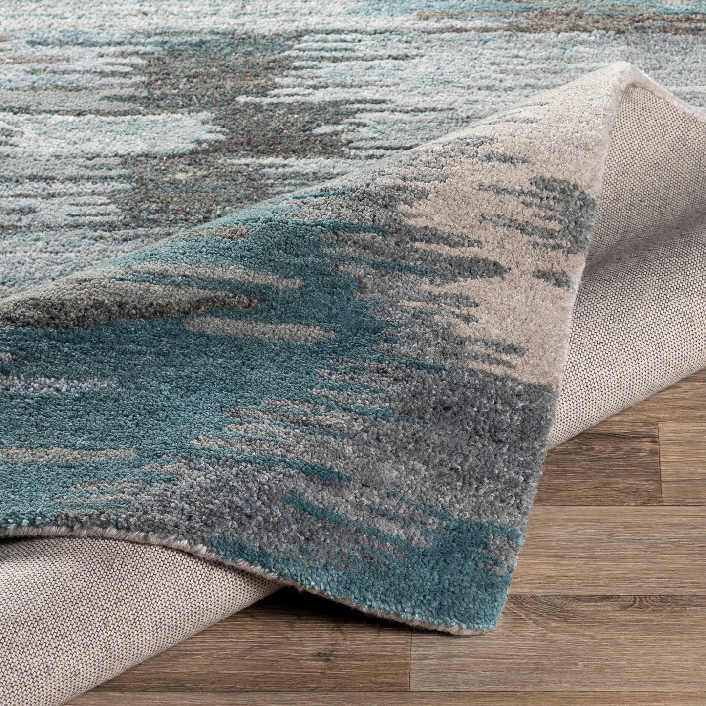 006 SR-756751,SR-756752,SR-756753,SR-756754,SR-756755 | Closeup | Montclair Rug - 24645 by Surya in teal, sage, light beige, charcoal, blue, light gray. Made from 80% wool, 20% viscose in a unique style.