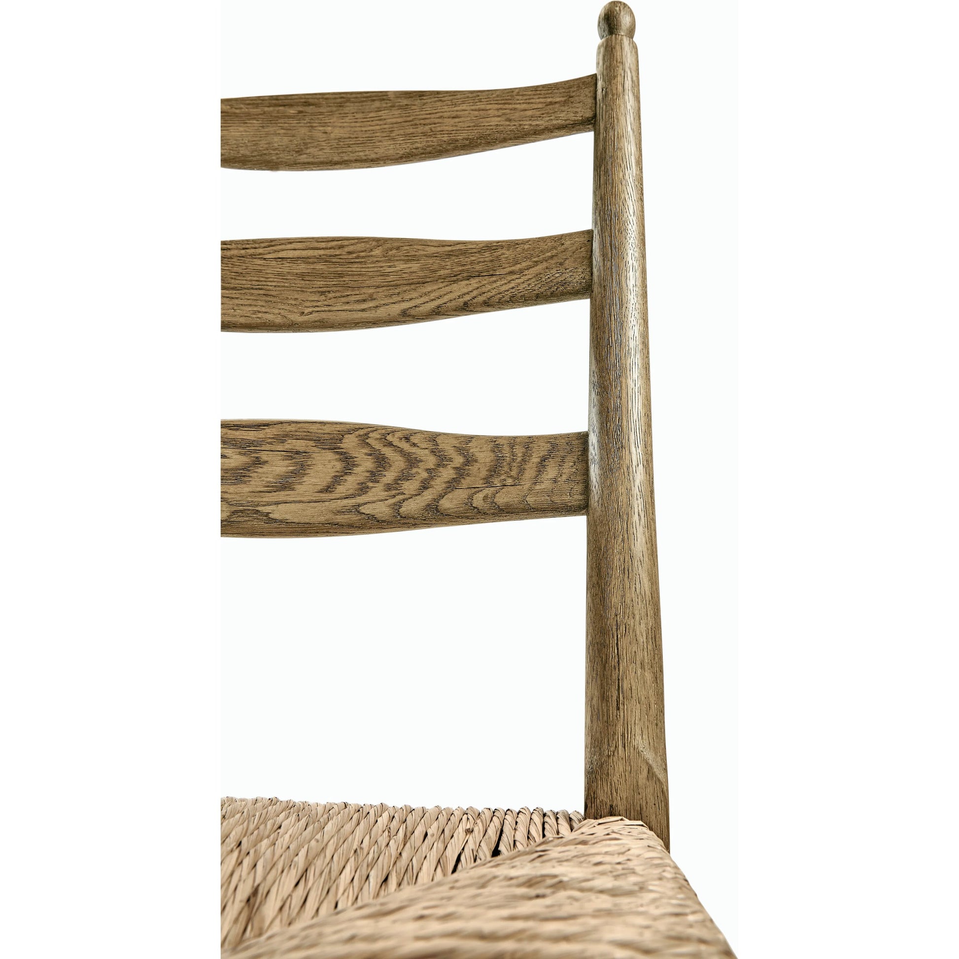 Timeless Doppler Ladderback Side Chair by Jonathan Charles in brown. Made from oak, fiber rush, foam, fabric in a coastal style.