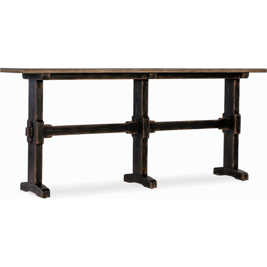 Americana Trestle Console Table by Hooker Furniture in black and molasses finish. Made from oak veneers with solid-wood edge top in a modern style.
