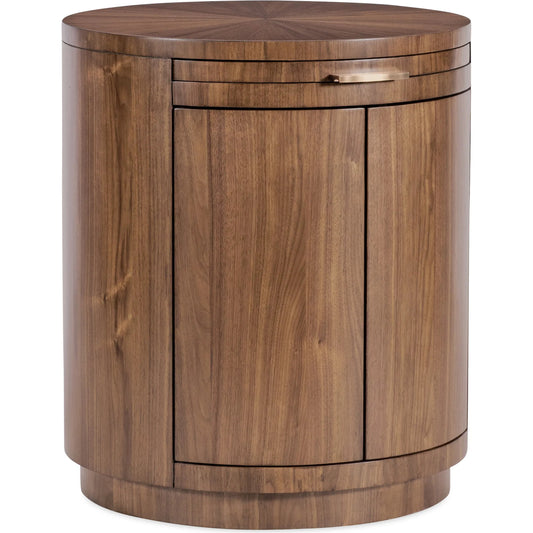 Eleana Round Nightstand by Hooker Furniture in light caramel, quartered walnut veneers, sunlit bronze metal. Made from walnut veneers in a modern style.