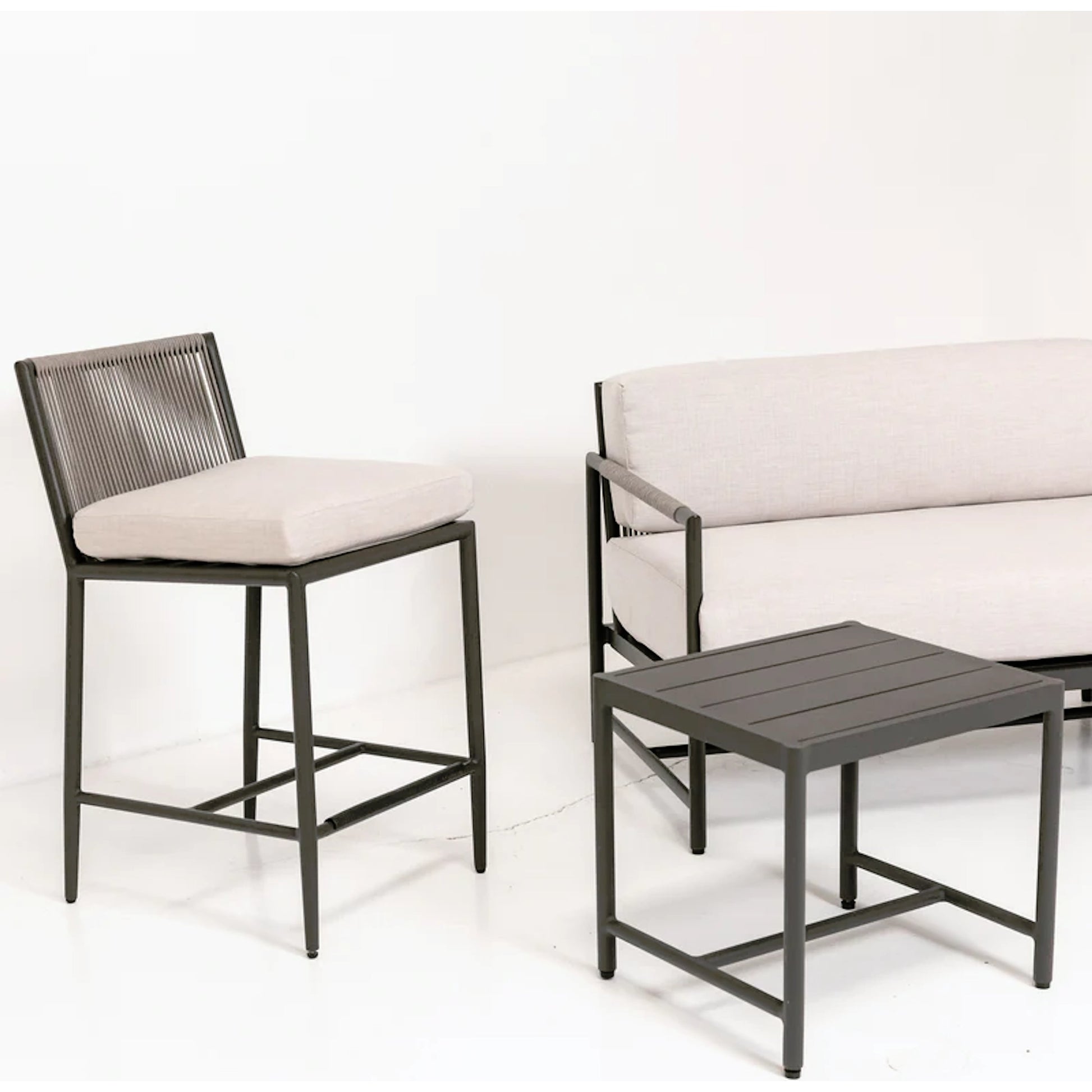 Pietra Outdoor End Table by Sunset West in graphite. Made from olefin rope in a modern style.