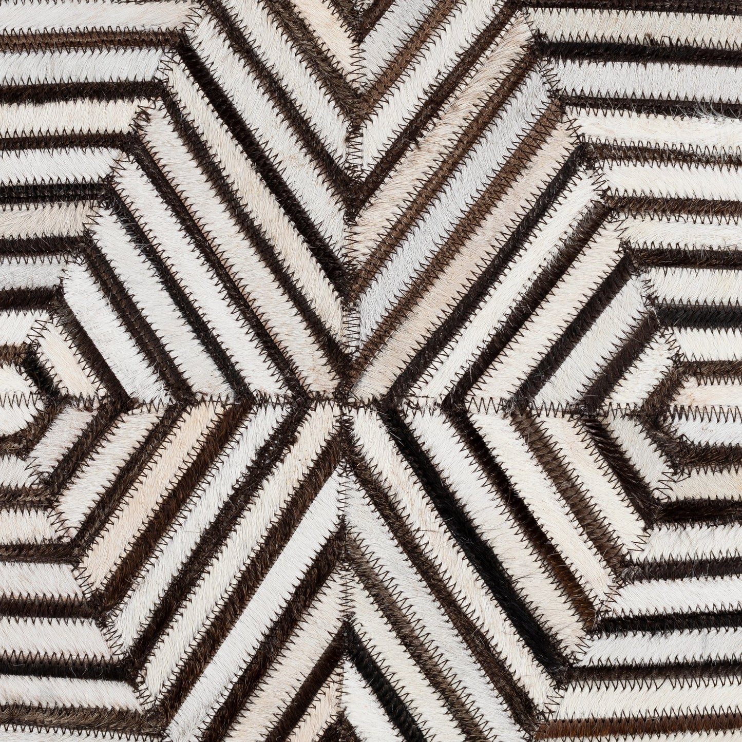 003 SI-1887044,SI-1887045 | Closeup | Nashville Pillow - 23455 by Surya in cream, tan, black, light gray. Made from 100% hair on hide, 100% cotton in a unique style.
