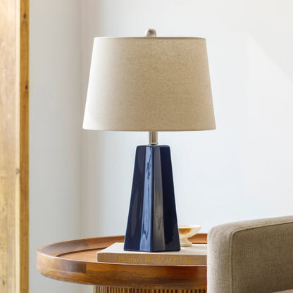 Stellan Table Lamp - 31886 by Livabliss in glazedpolished. Made from shade (outside): linen, shade (inside): polyester, body: ceramic, finial: metal, harp: metal in a modern style.