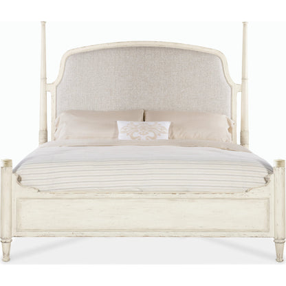 Americana California King Upholstered Poster Bed by Hooker Furniture in beige and worn white. Made from oak veneers and fabric in a traditional style.