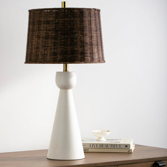 Nino - 479375 by Surya in body: white, shade: brown, finial: metallic - brass, harp: metallic - brass, cord: translucent and painted. Made from body: resin, shade (outside): rattan, finial: metal in a cottage & farmhouse style.