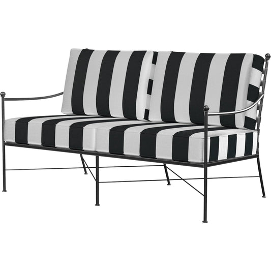 Provence Outdoor Loveseat by Sunset West. Made from wrought iron in a modern style.