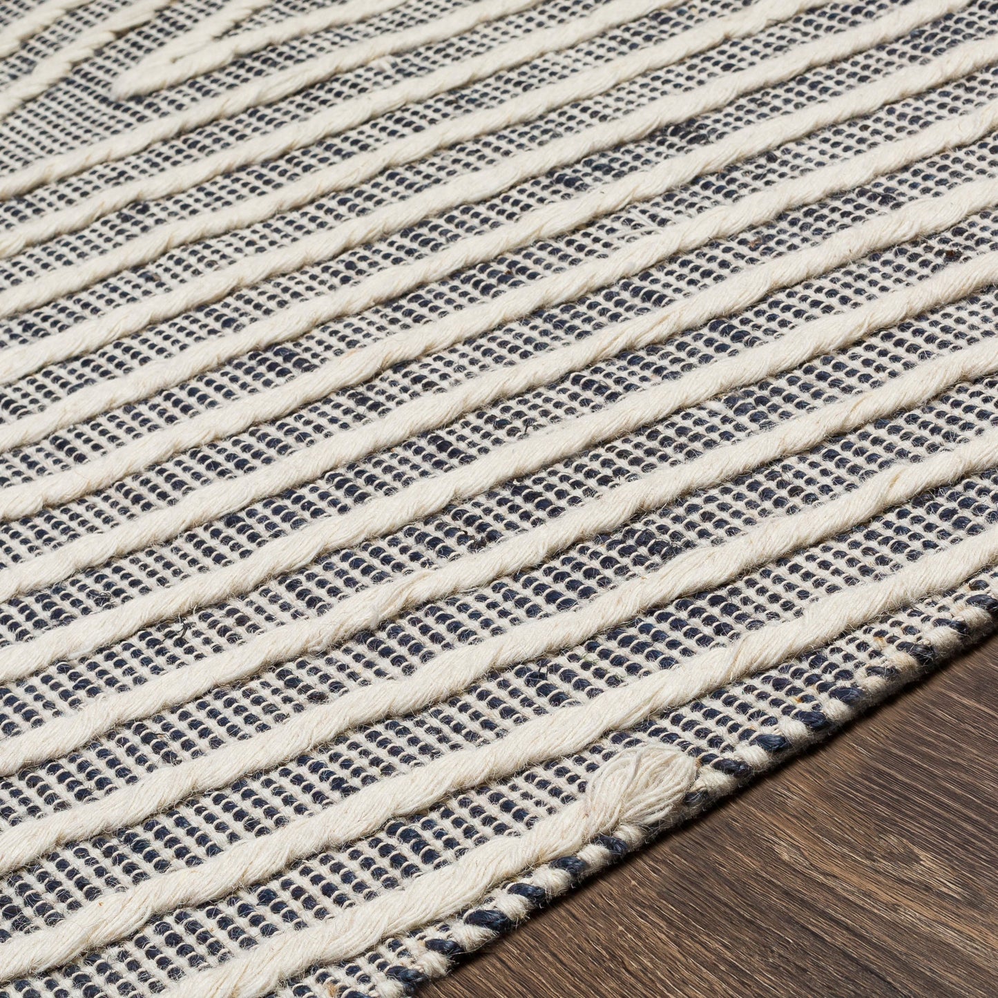 004 SI-1833303,SI-1833304,SI-1833306 | Closeup | Norwood Rug - 27916 by Livabliss in black, ink blue, cream. Made from 60% jute, 40% wool in a unique style.