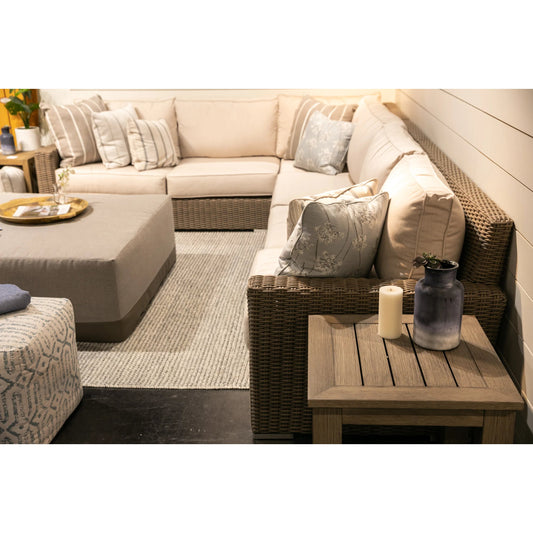 Coronado Outdoor Sectional in Canvas by Sunset West in driftwood. Made from resin wicker in a modern style.
