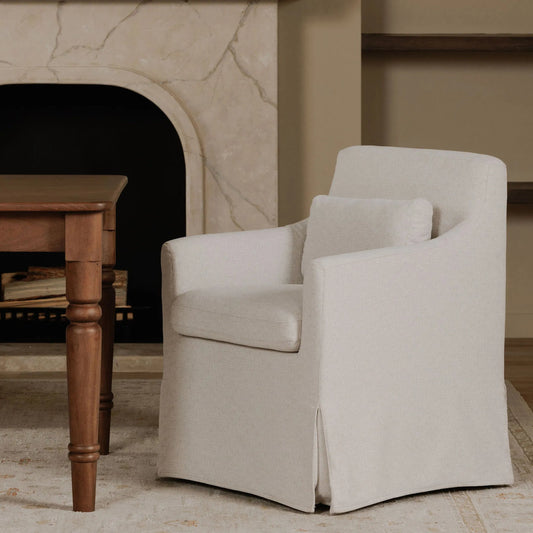 Lydia Slipcover Dining Chair by Moe's Home Collection in beige. Made from upholstery: 100% polyester, foam, plywood, nylon castors in a unique style.