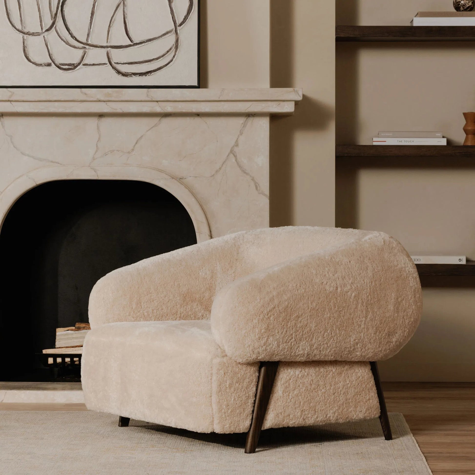 Devlin Lounge Chair by Moe's Home Collection in cream faux fur. Made from upholstery: 100% polyester, ash wood leg, foam, fiber seat, plywood frame in a transitional style.