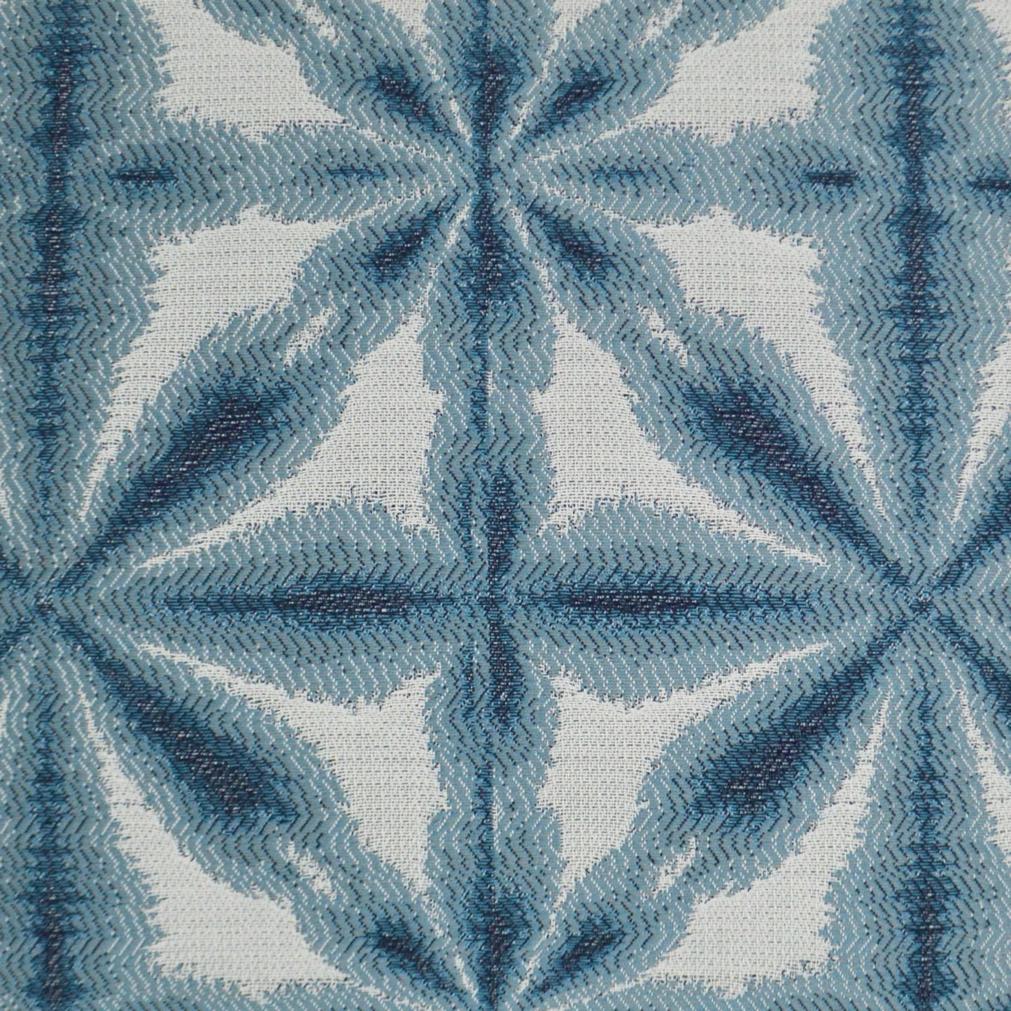 002 SI-2382396 | Closeup | Sunshibo Flower Indoor/Outdoor Pillow by DV Kap Home in blue. Made from 85% solution dyed polyester, 15% solution dyed acrylic in a transitional style.