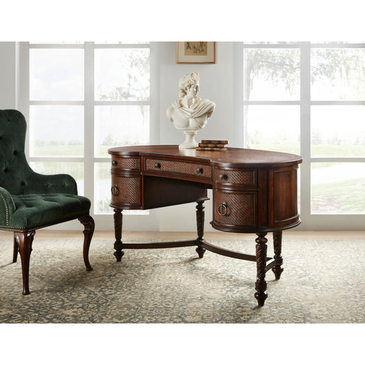 Charleston Kidney Writing Desk by Hooker Furniture in maraschino cherry. Made from cherry veneers, robus leather, rattan, resin in a traditional style.