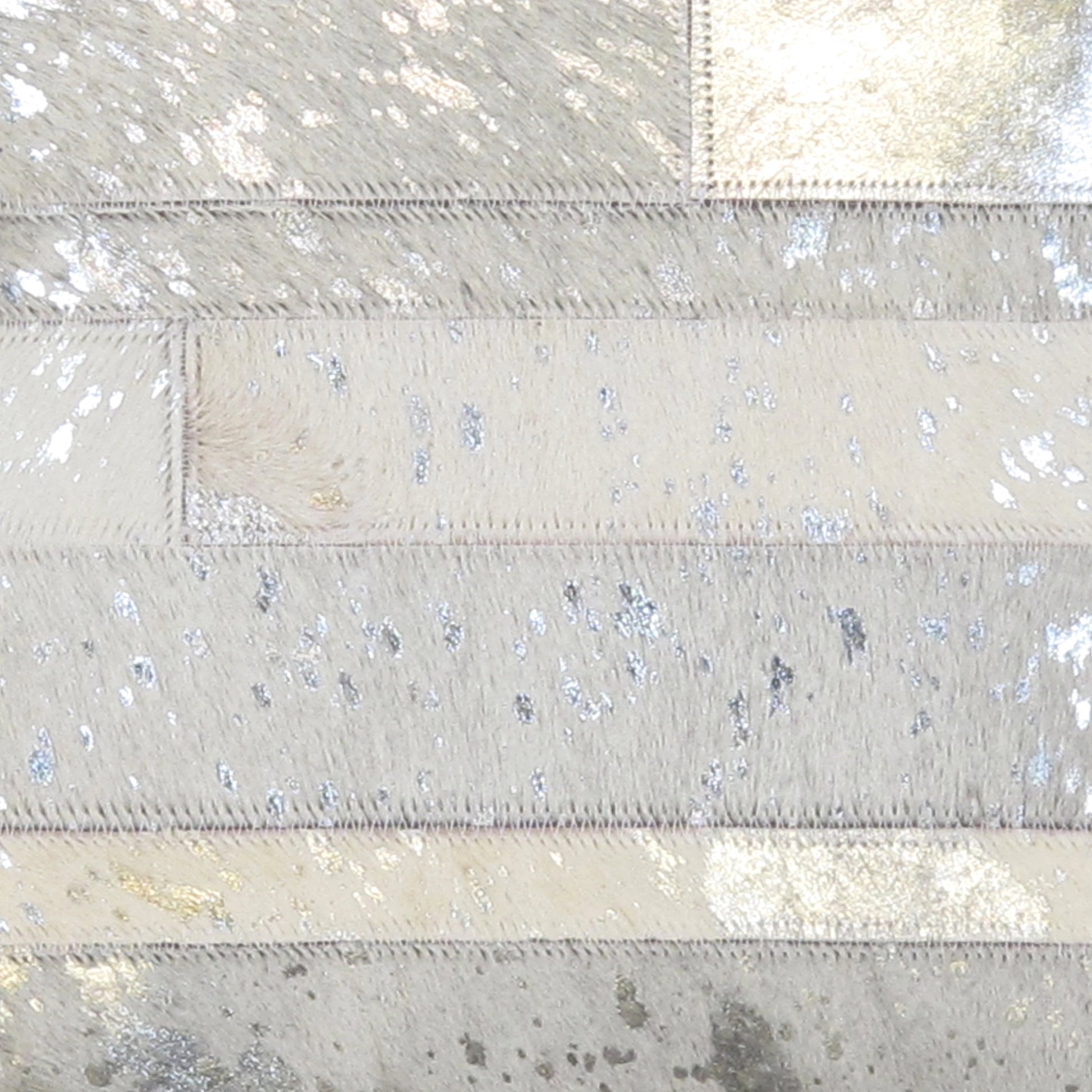 Cowhide Throw Pillow by Pasargad Home in silver. Made from cowhide in a modern style.