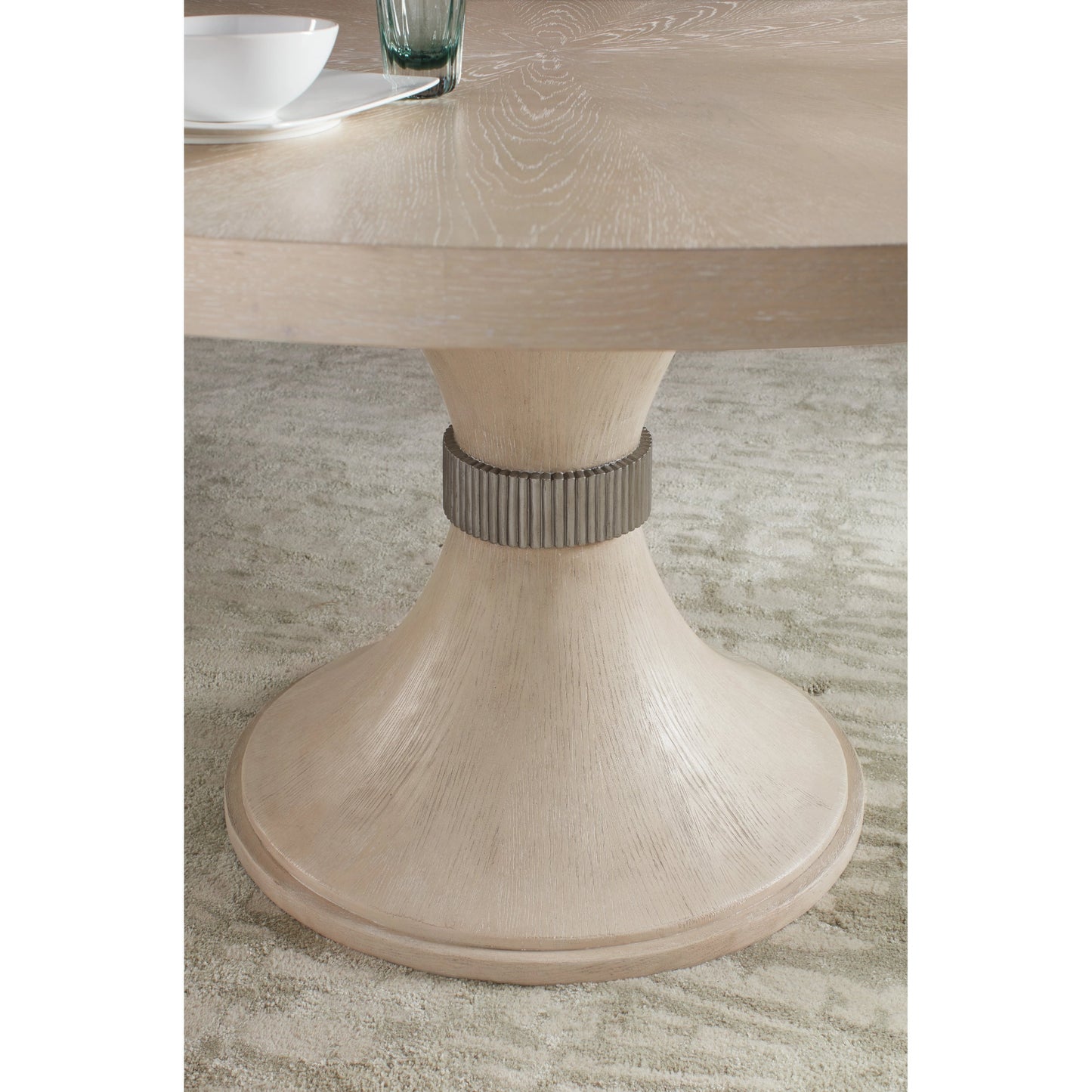 003 SI-2028935 | Closeup | Nouveau Chic Round Pedestal Dining Table by Hooker Furniture in sandstone. Made from oak veneers, resin in a modern style.
