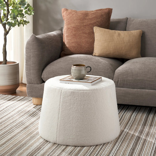 Mendocino Wide Flared Ottoman by HedgeApple Essentials in ivory. Made from plywood sherpa in a unique style.
