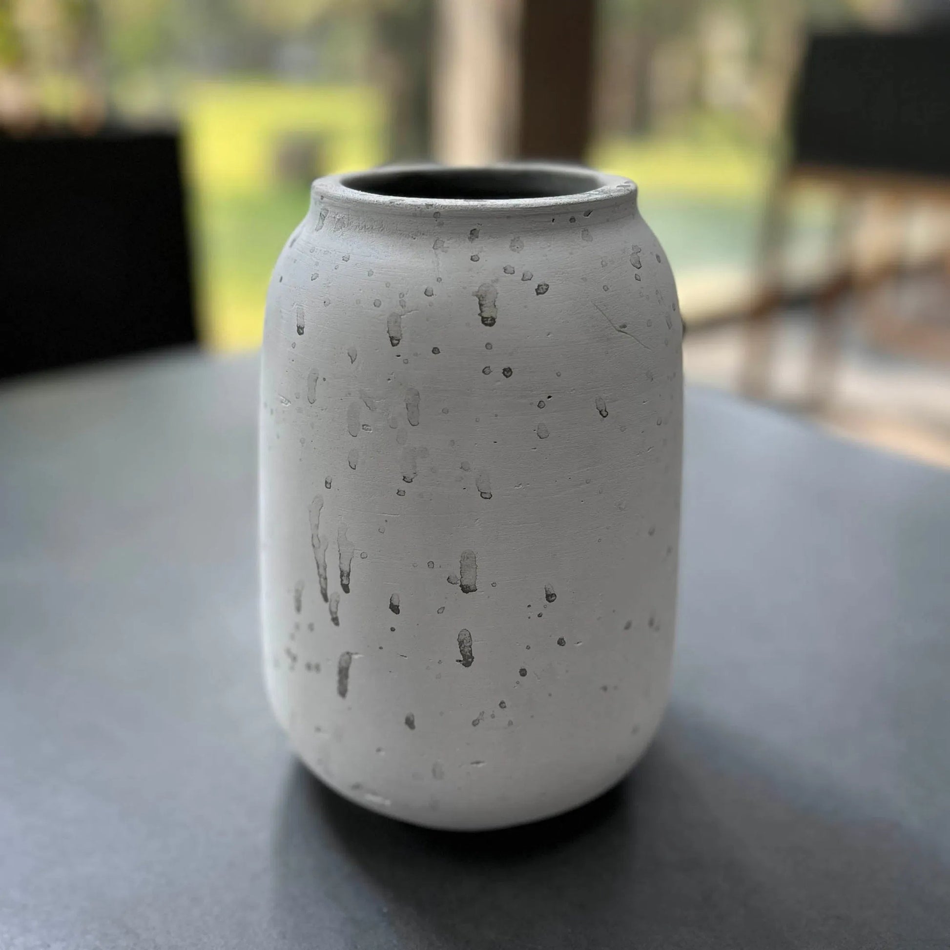 Taxco Vase by LH Imports in antique white. Made from antique white ro-cement in a unique style.