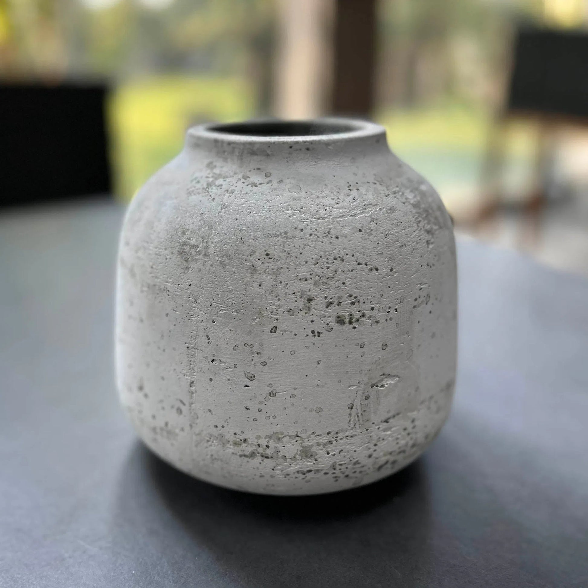 Taxco Vase by LH Imports in antique white. Made from antique white ro-cement in a unique style.