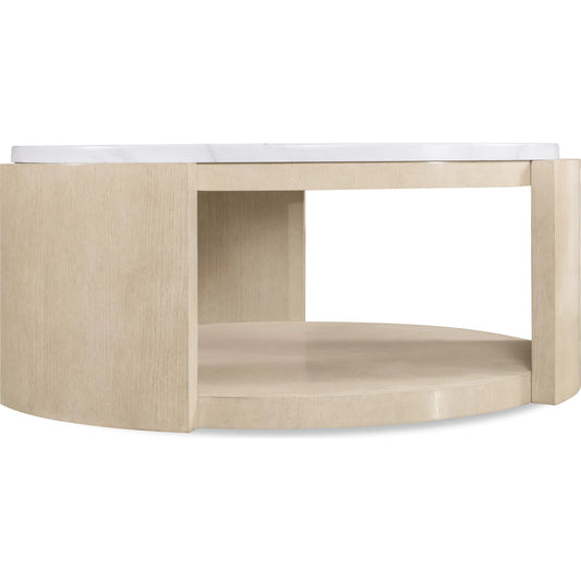 Westwood Round Cocktail Table by Hooker Furniture in polished limestone, quartered oak veneers. Made from glass reinforced concrete, oak veneers, leather, hair on hide leather in a transitional style.