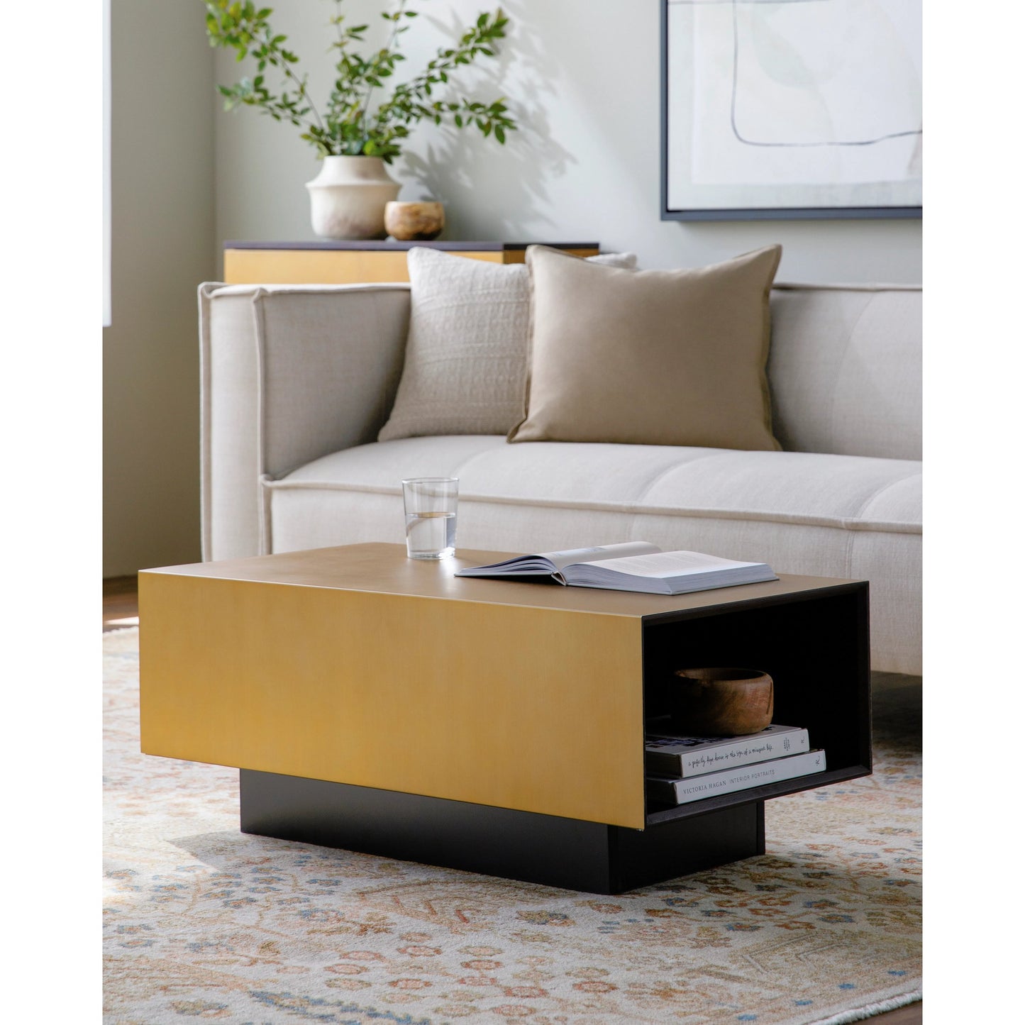 002 SI-2053839 | Lifestyle | Peaceful Large Coffee Table by Surya in gold, dark brown and painted. Made from top: manufactured wood, base: manufactured wood in a modern style.