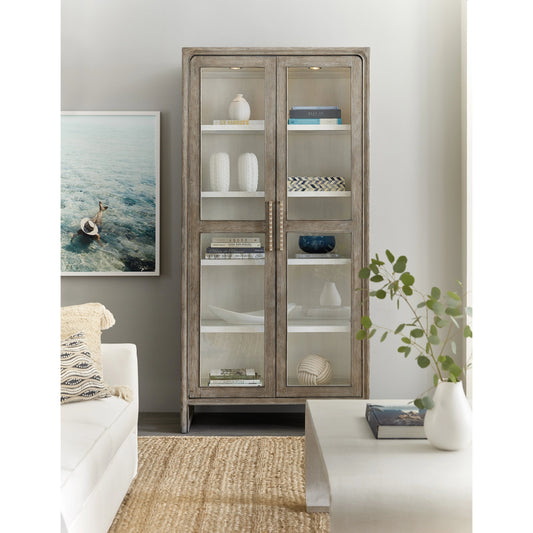 Serenity Sanderling Display Cabinet by Hooker Furniture in malibu, champagne. Made from oak veneers, tempered glass in a modern style.