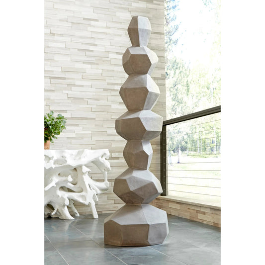 Faceted Rock Column Sculpture by Phillips Collection in gray and stone cast. Made from resin composite in a modern style.
