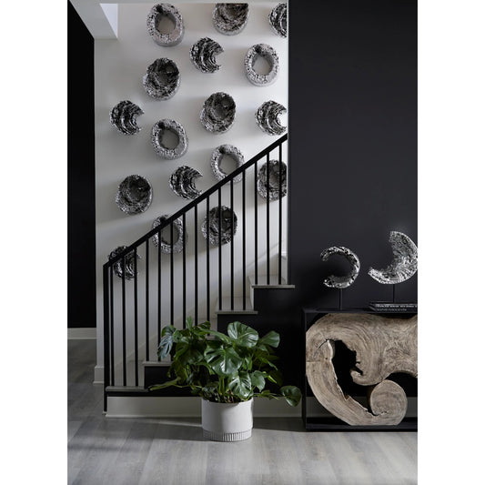 Cast Eroded Wood Circle on Stand II by Phillips Collection in silver, black and silver leaf. Made from resin metal in a transitional style.