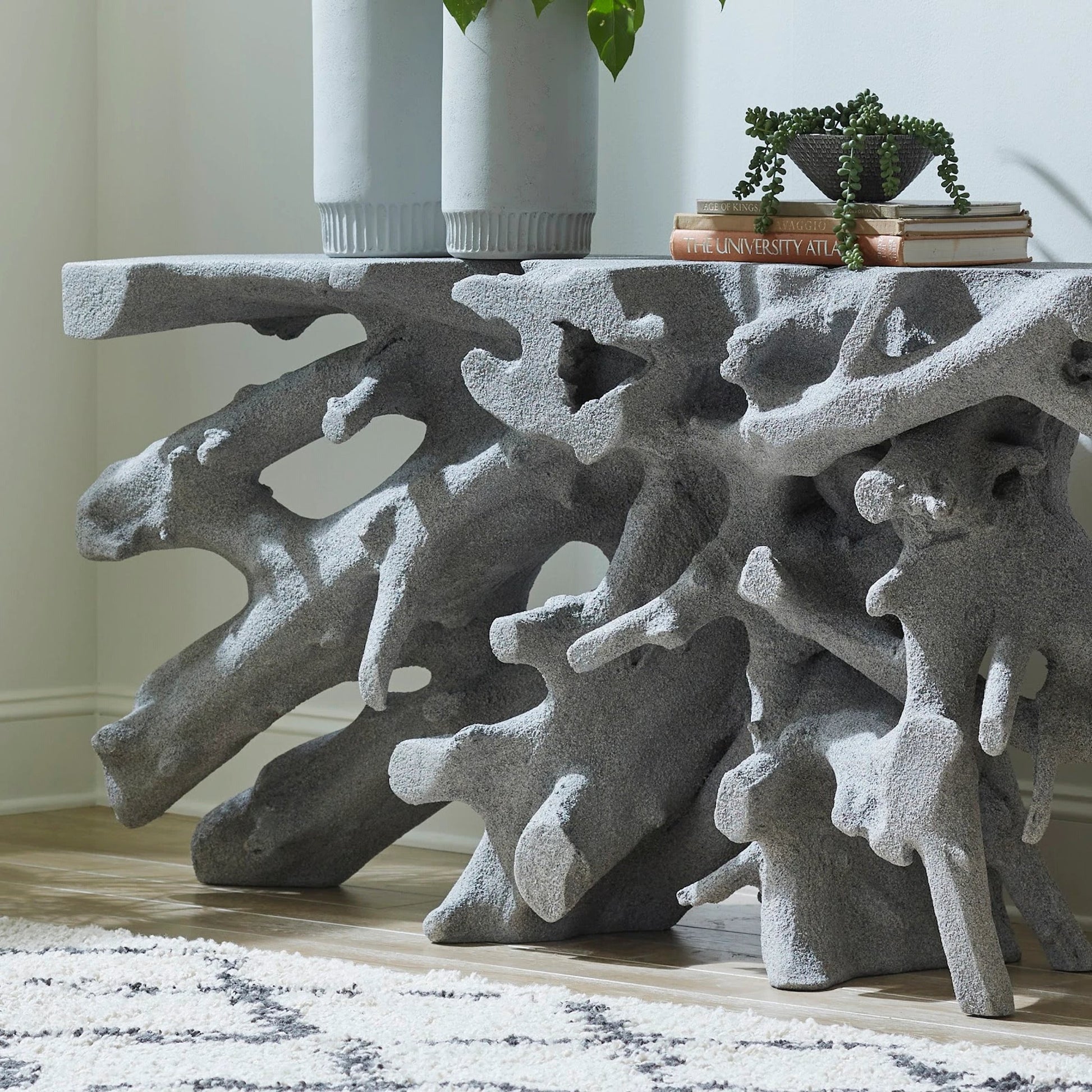 Beau Cast Root Console Table by Phillips Collection. Made from resin in a coastal style.