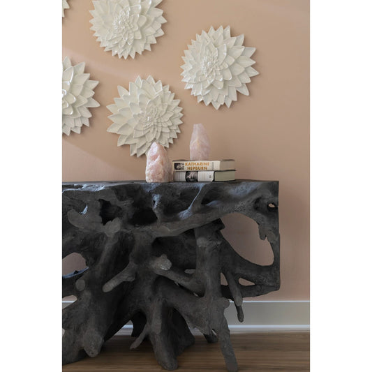 Cast Root Console by Phillips Collection in gray and charcoal stone. Made from resin in a transitional style.